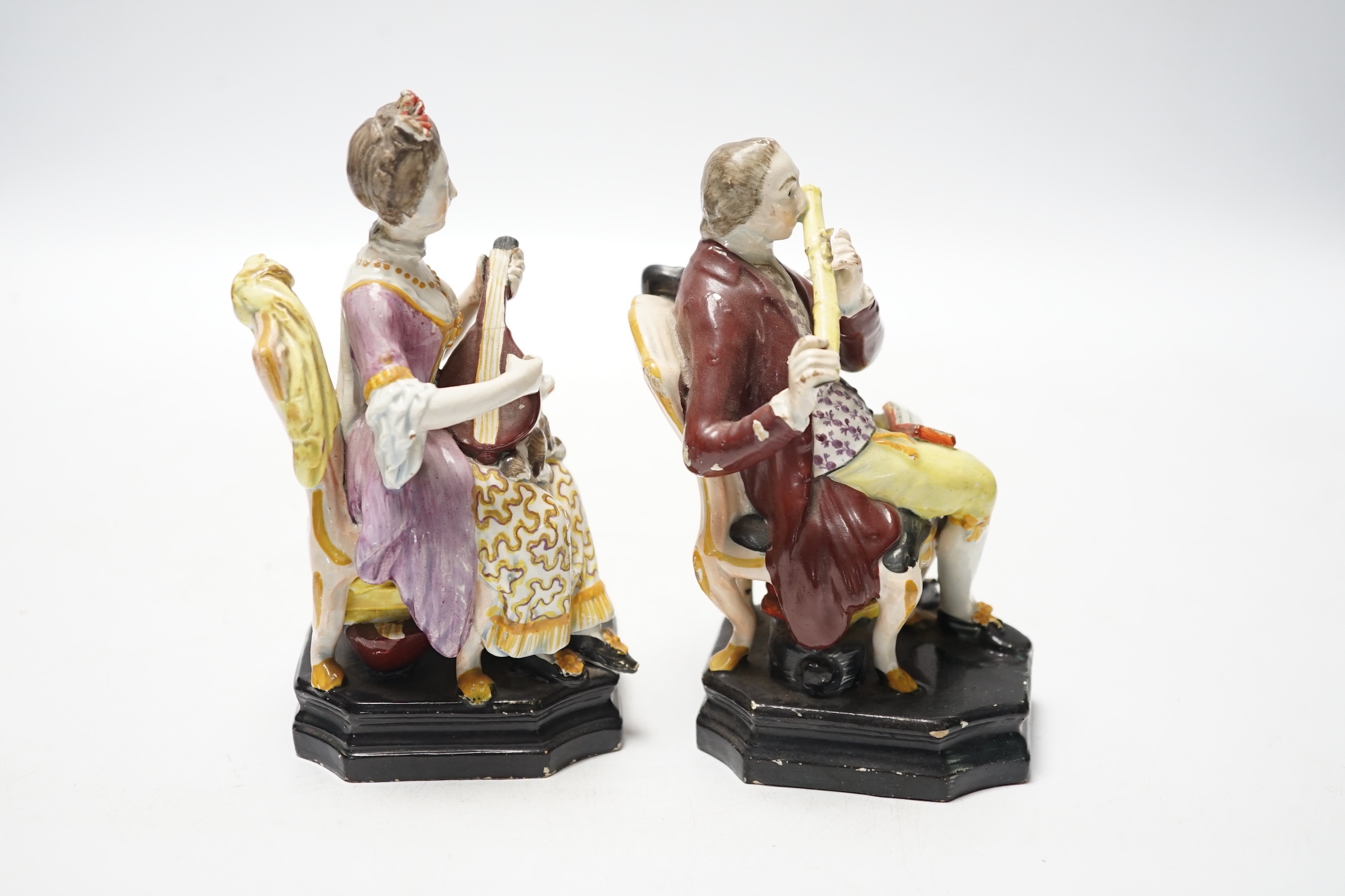 A pair of Staffordshire pearlware figures of musicians seated on chairs, c.1825, 14cm